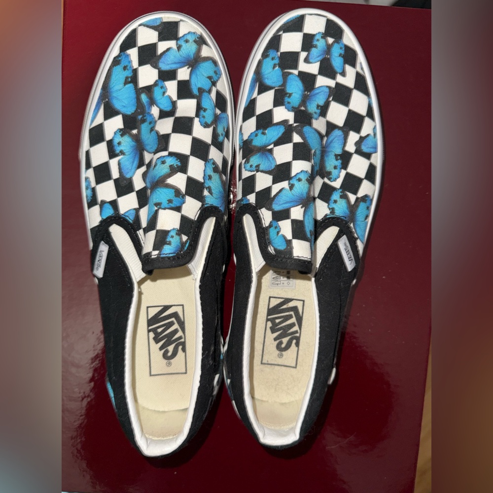 Vans Black and White Checkerboard Slip-Ons with Blue Butterflies